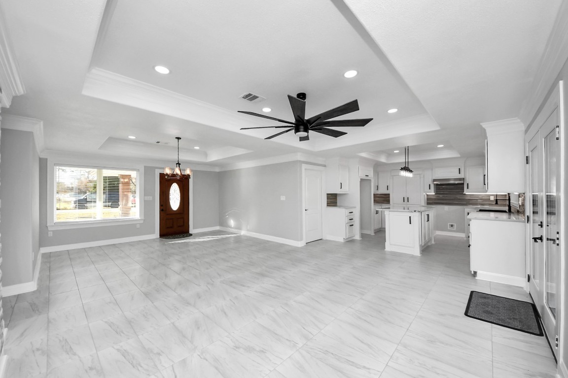 16121 Palm Street Channelview, TX 77530 - Photo 8 of 26 a view of an empty room with a window and kitchen view