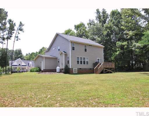 2708 Rustic Brick Road Raleigh, NC 27603 - Photo 11 of 12 a view of a house with a yard