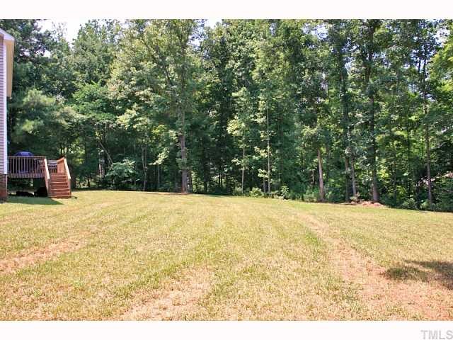 2708 Rustic Brick Road Raleigh, NC 27603 - Photo 12 of 12 a view of a yard with a tree