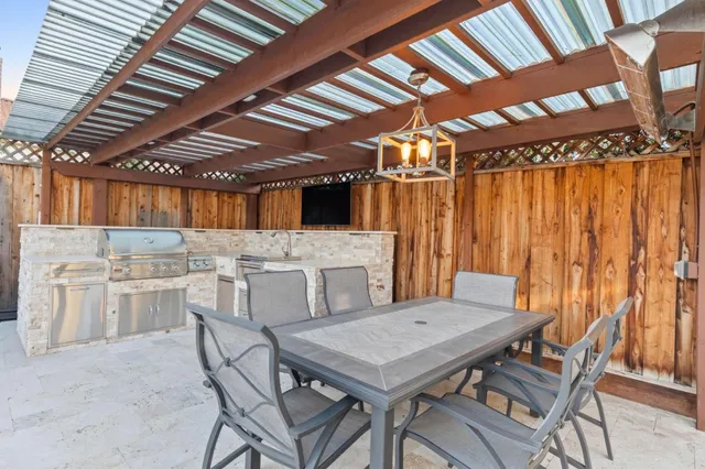 a view of a table and chairs in patio