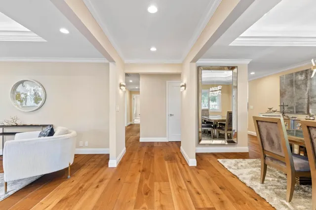 a spacious bathroom with a sink a mirror a bathtub and next to a window