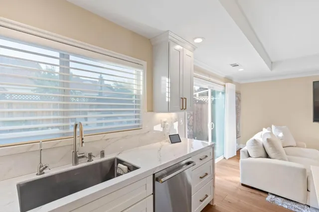 a kitchen with a sink and a refrigerator