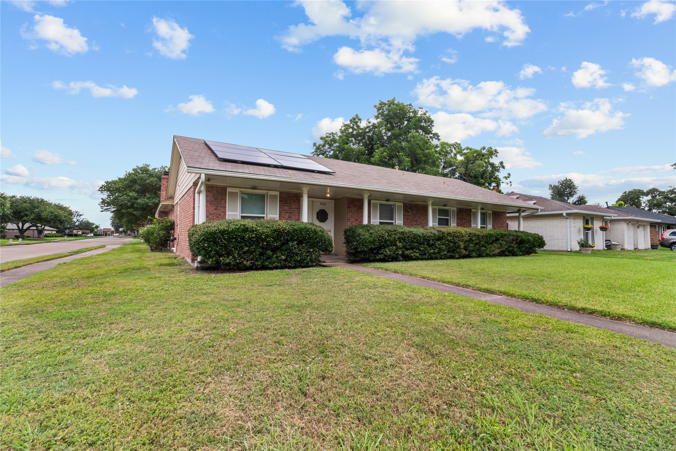 Curb appeal galore! A classic brick exterior, covered front porch, and well-maintained landscaping create a beautiful first impression. This is the home you’ll be proud to pull up to every day.