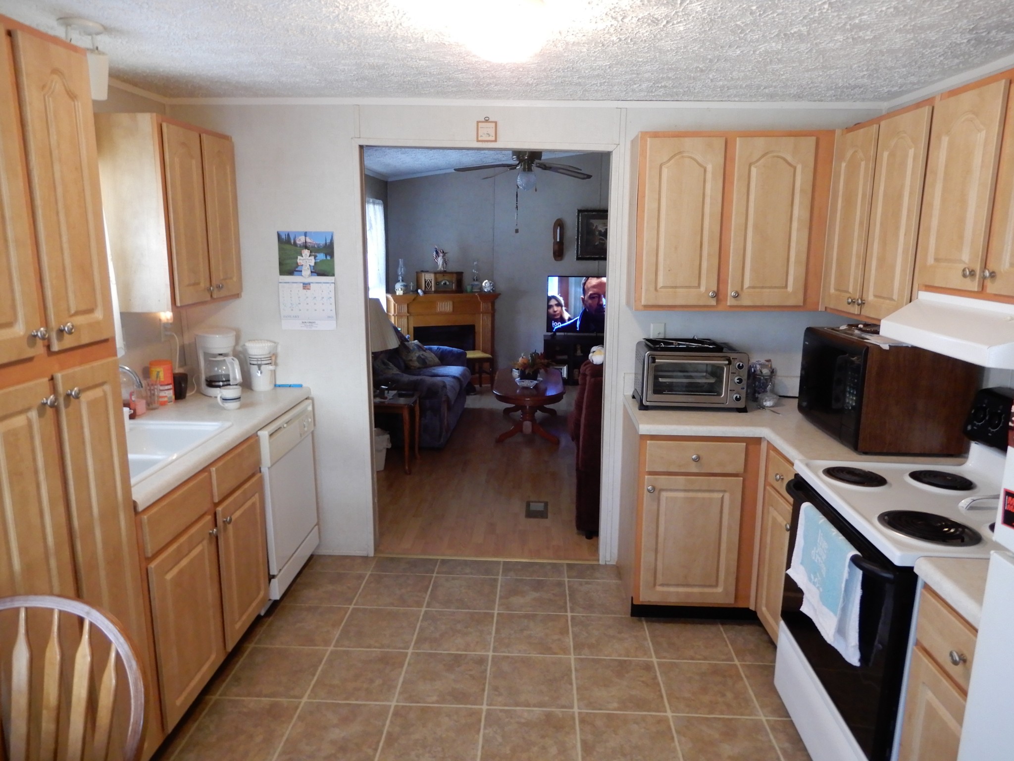 726 Plunders Creek Road Dickson, TN 37055 - Photo 3 of 14 a kitchen with a sink appliances cabinets and a window