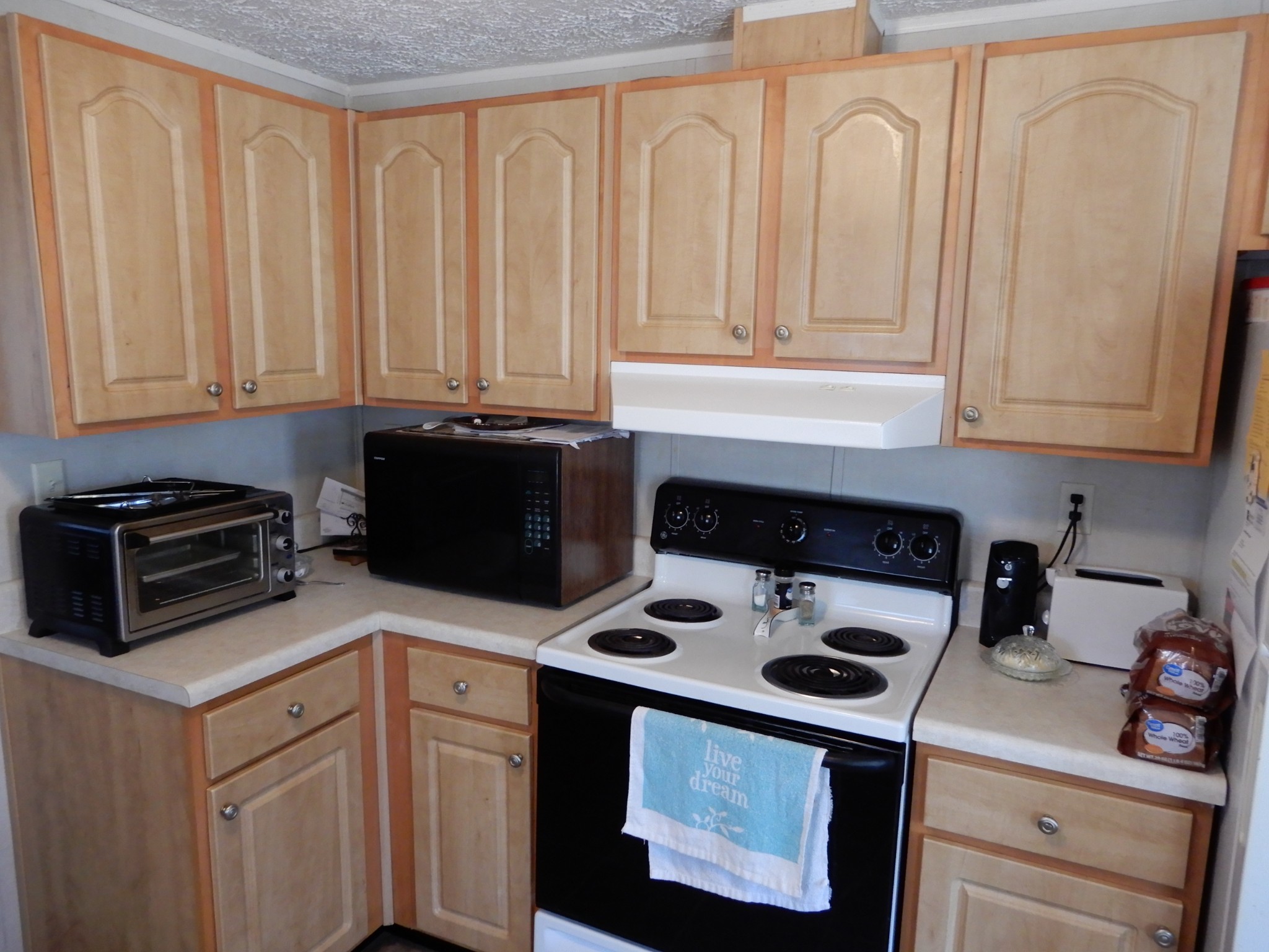 726 Plunders Creek Road Dickson, TN 37055 - Photo 4 of 14 a kitchen with stainless steel appliances granite countertop a stove a sink and a microwave