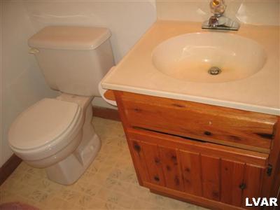 1320 Kroucher Road Stroudsburg, PA 18360 - Photo 25 of 27 a bathroom with a toilet and a sink