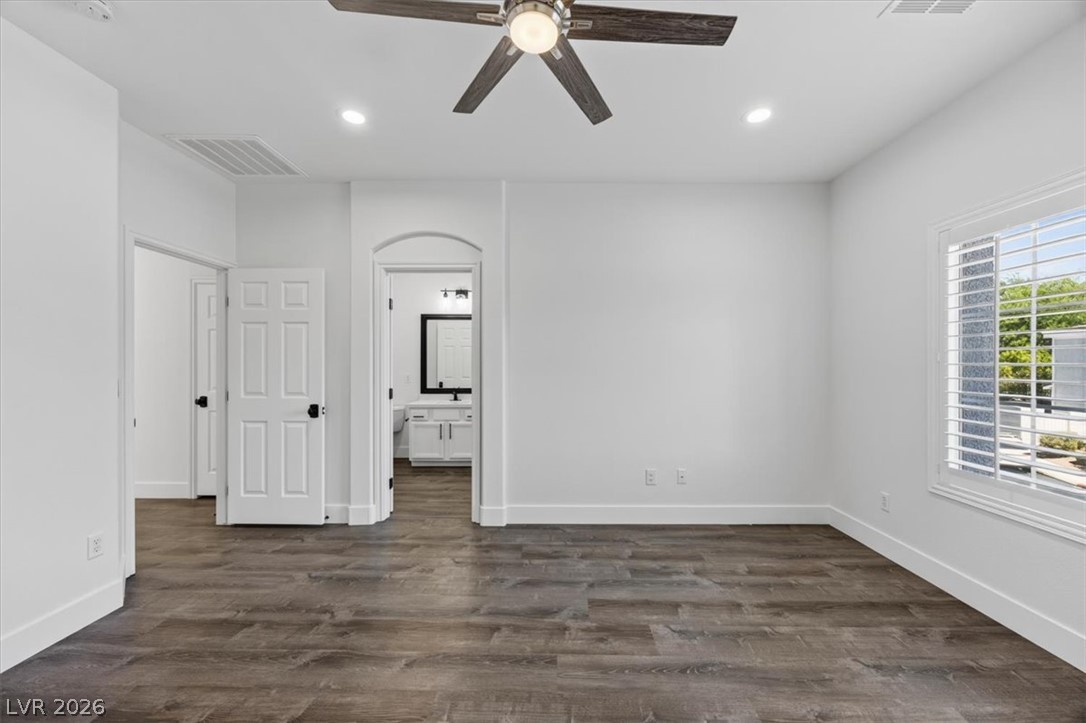251 Integrity Ridge Drive Henderson, NV 89052 - Photo 11 of 32 Gleaming hardwood floors and clean white walls create an inviting atmosphere in this airy room.