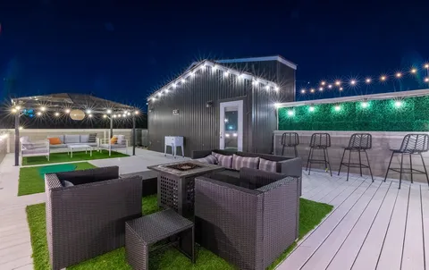 a patio with yard table and chairs
