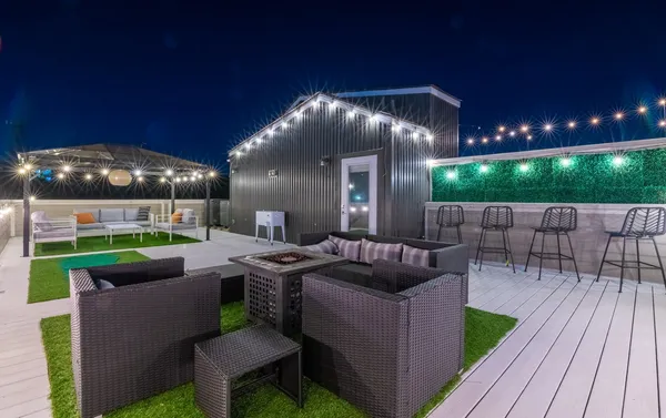 a patio with yard table and chairs