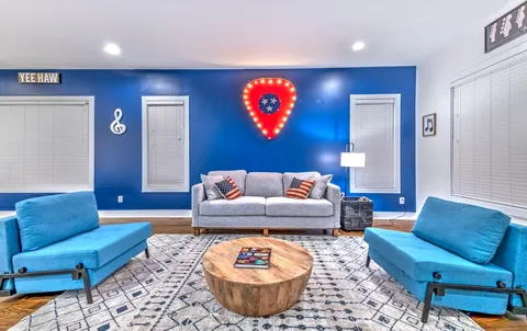 a living room with furniture a rug and a couch