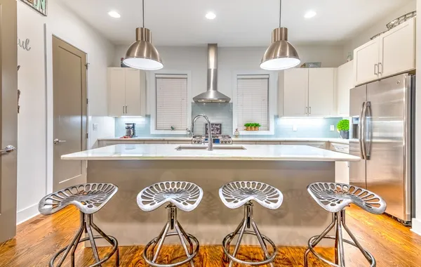 a view of kitchen and dining area with chandelier