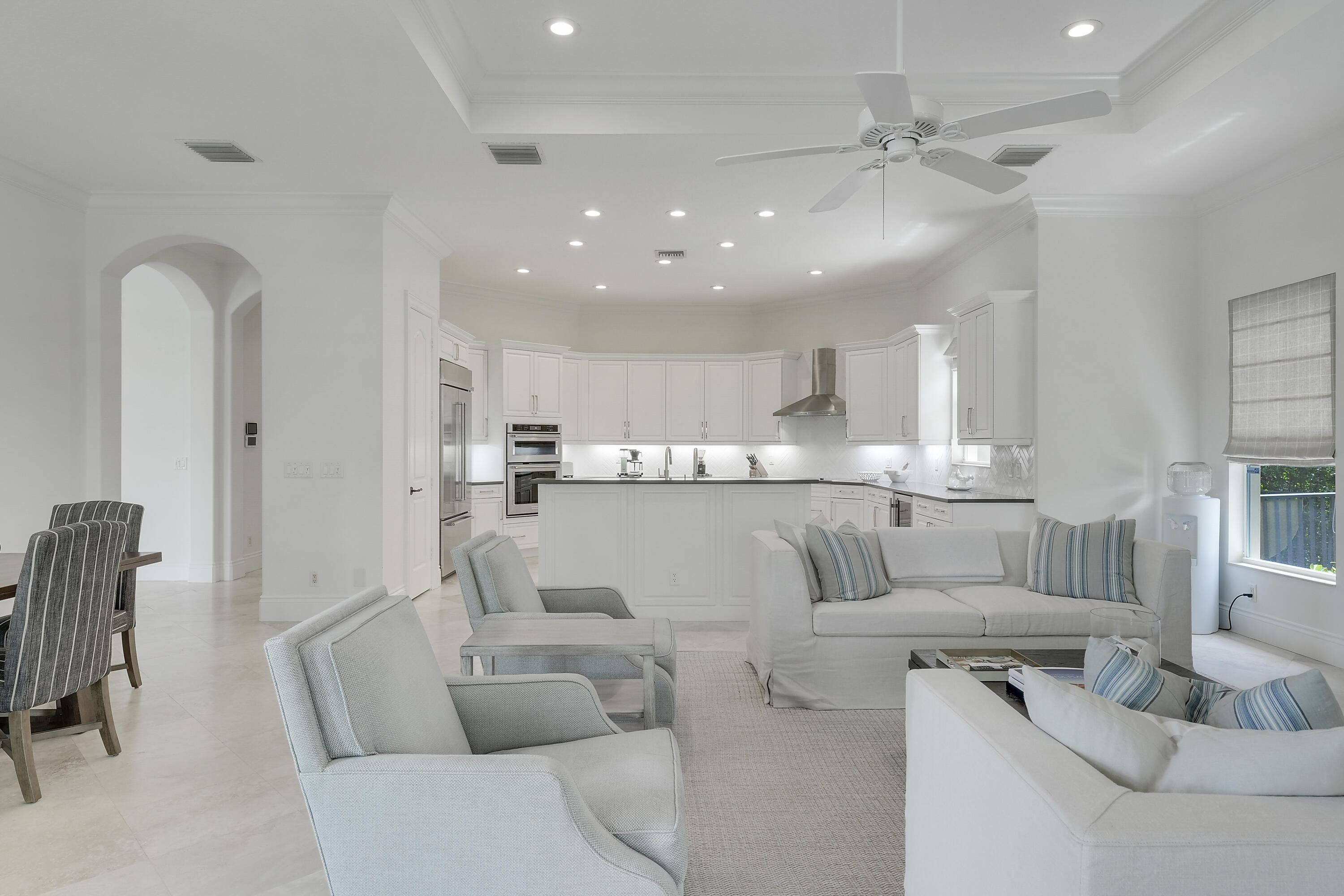 140 Tulip Tree Court Jupiter, FL 33458 - Photo 11 of 80 a living room with furniture and a view of kitchen