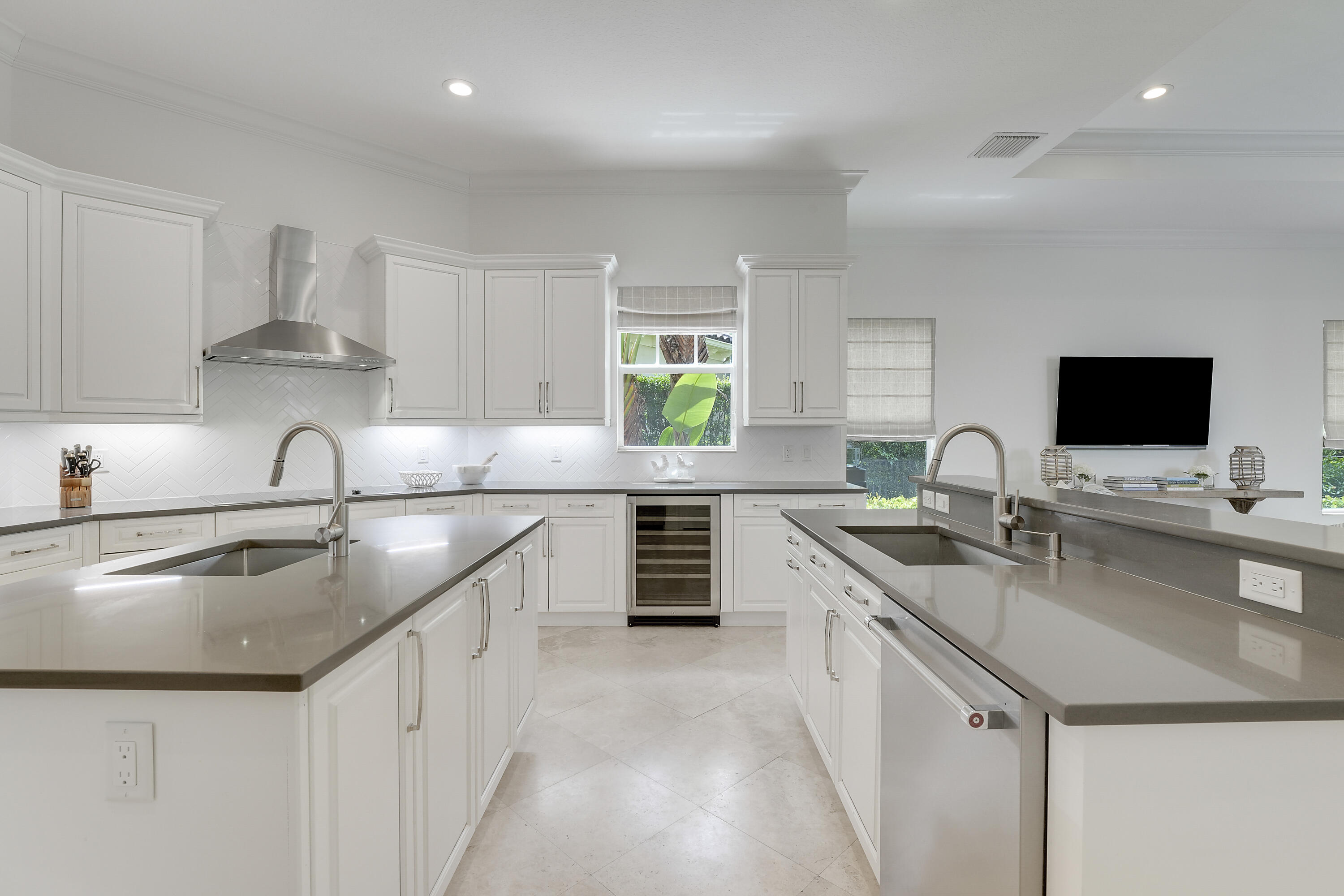 140 Tulip Tree Court Jupiter, FL 33458 - Photo 13 of 80 a kitchen with stainless steel appliances granite countertop a sink stove and refrigerator