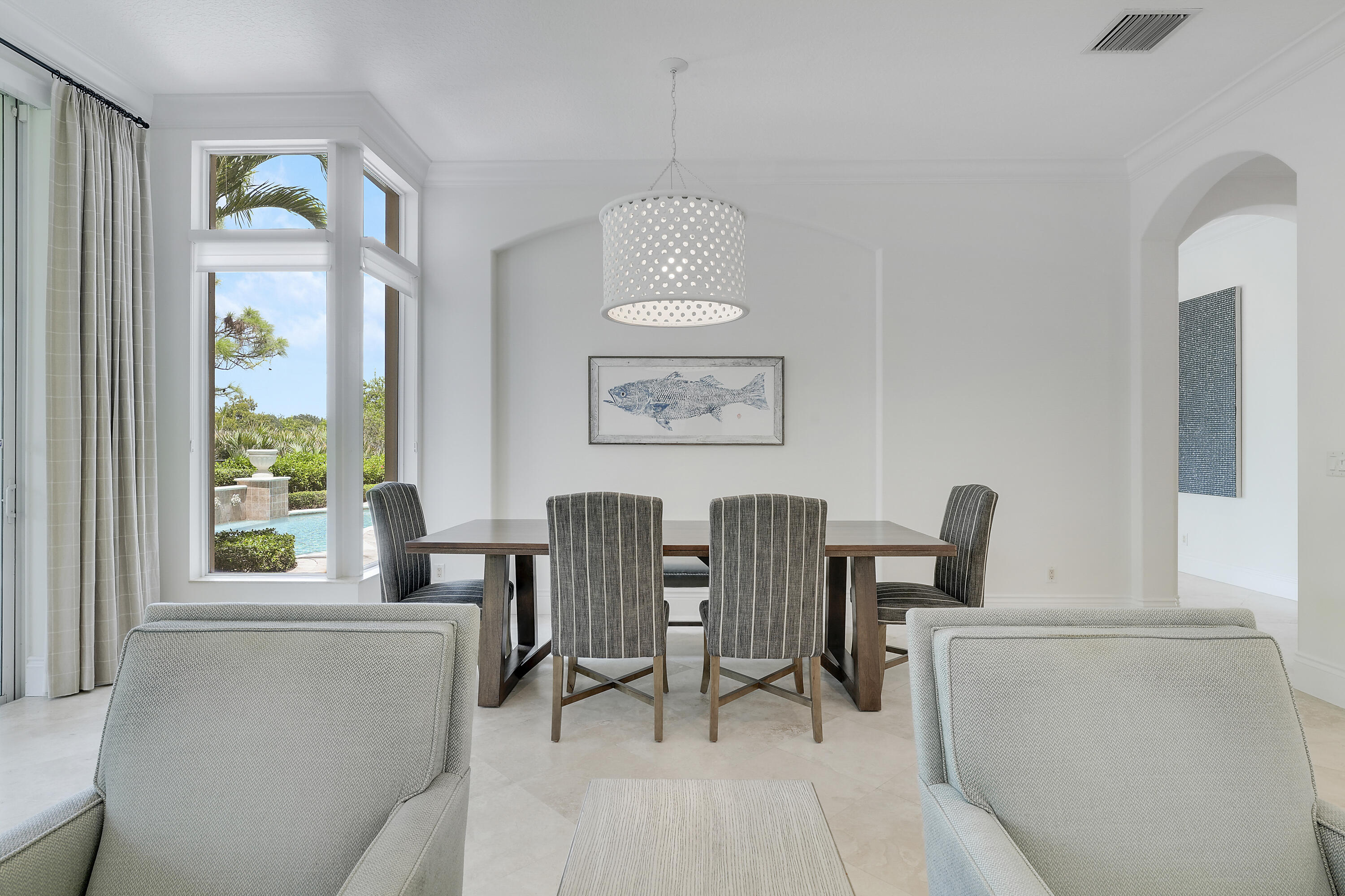 140 Tulip Tree Court Jupiter, FL 33458 - Photo 21 of 80 a view of a dining room with furniture and windows