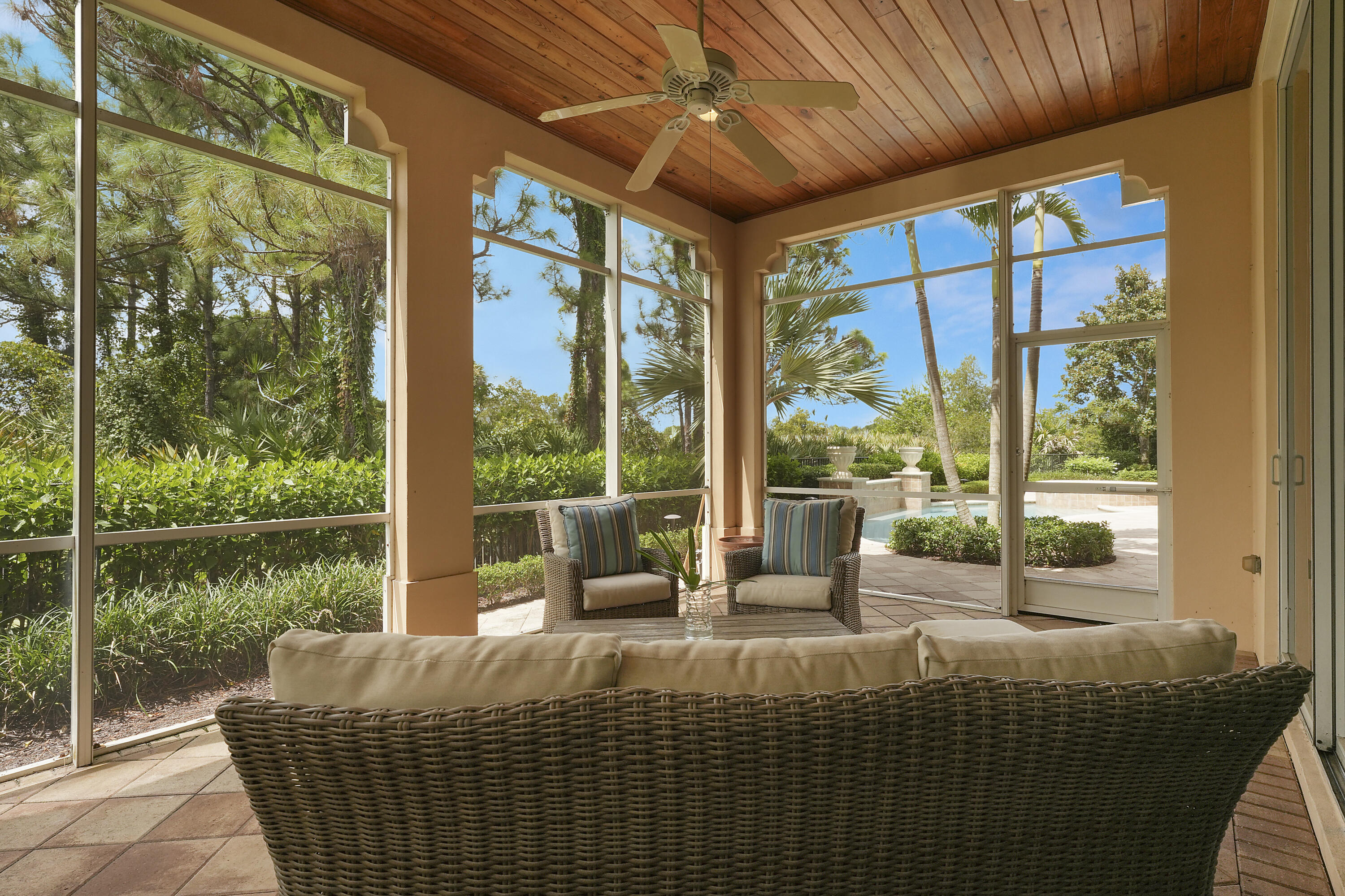 140 Tulip Tree Court Jupiter, FL 33458 - Photo 23 of 80 a bed sitting in a bedroom next to a window