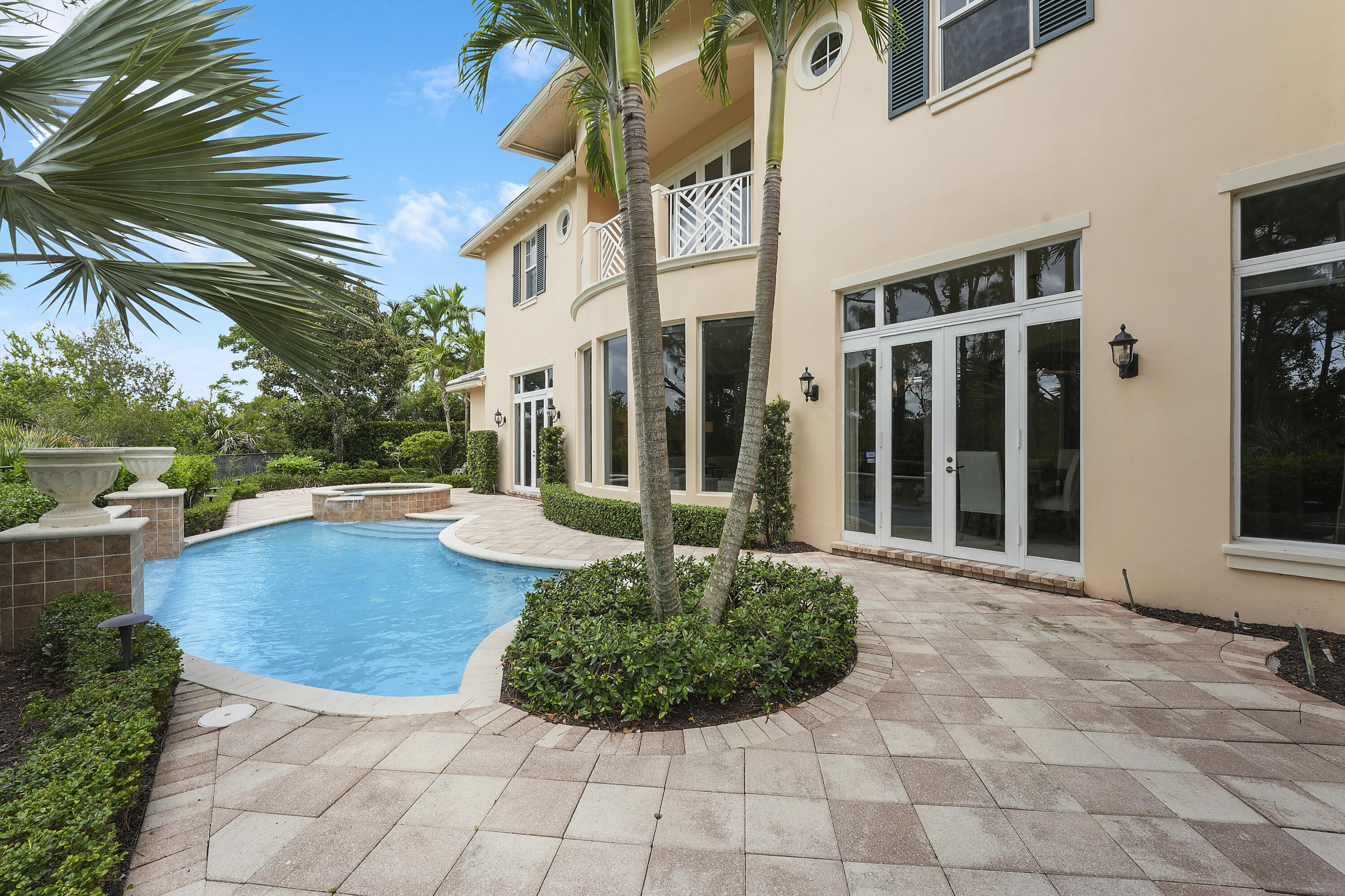 140 Tulip Tree Court Jupiter, FL 33458 - Photo 26 of 80 a view of a house with backyard and sitting area