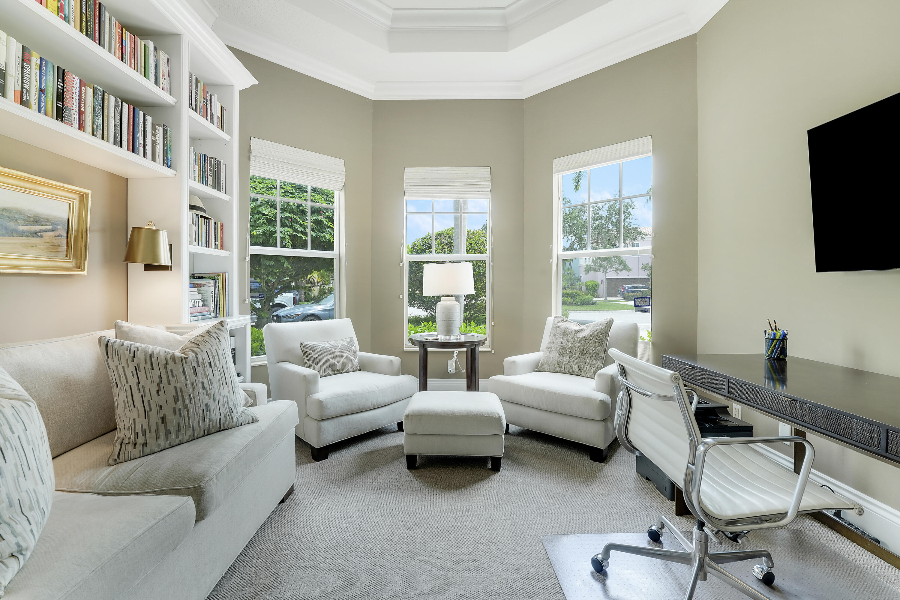 140 Tulip Tree Court Jupiter, FL 33458 - Photo 33 of 80 a living room with furniture a flat screen tv and a window