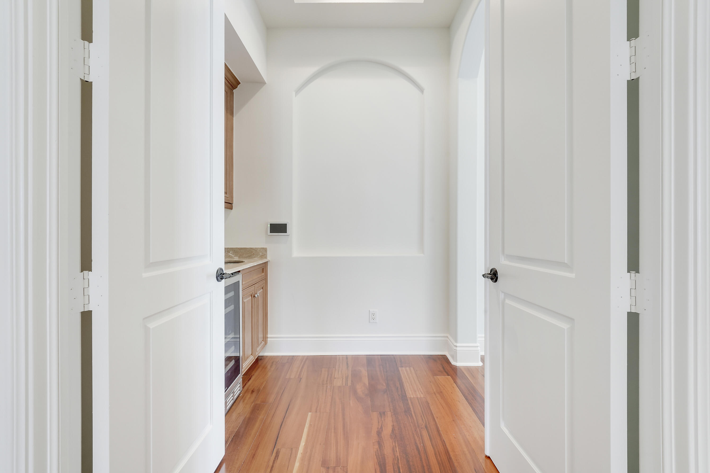 140 Tulip Tree Court Jupiter, FL 33458 - Photo 43 of 80 a view of a room with wooden floor and a hallway