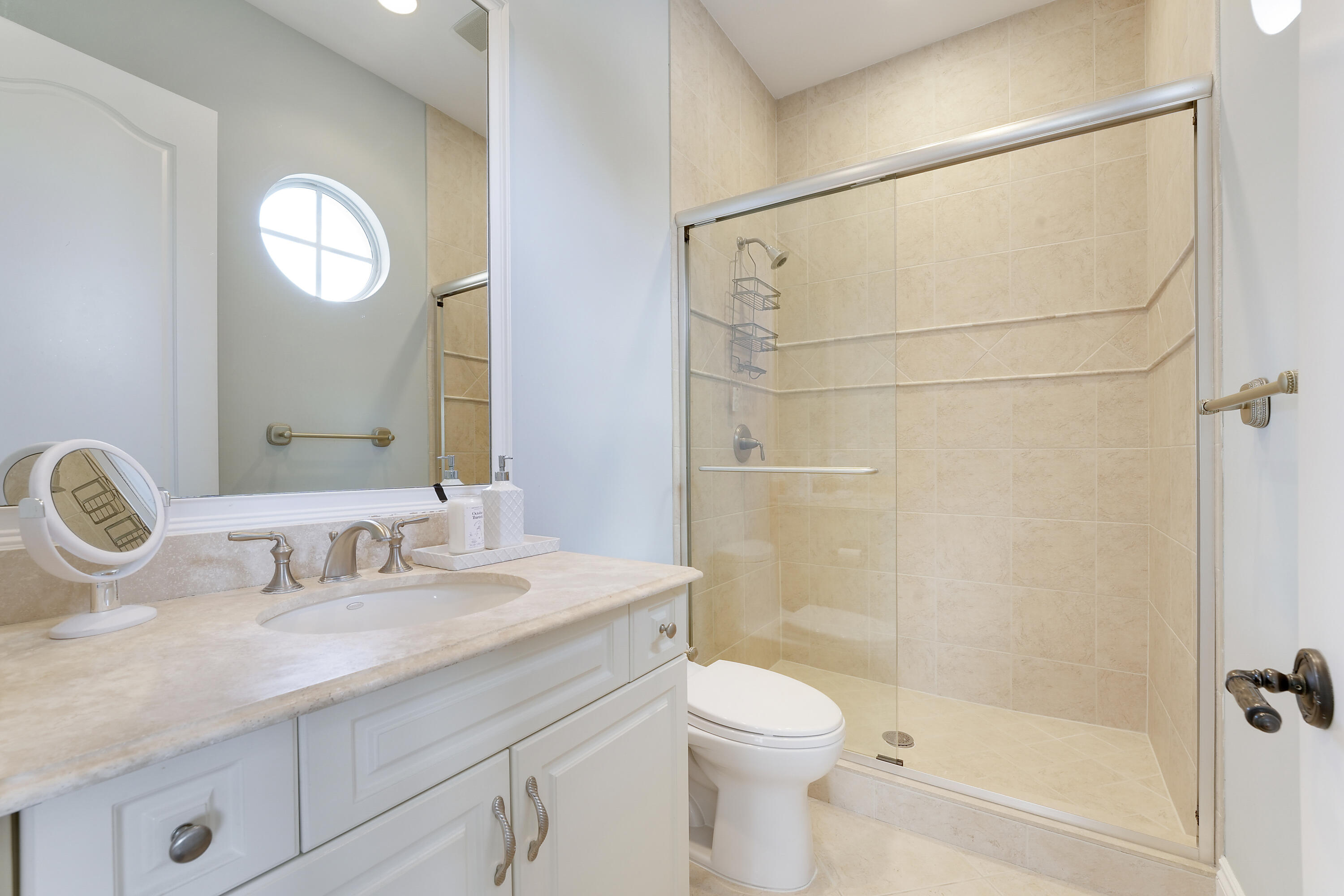 140 Tulip Tree Court Jupiter, FL 33458 - Photo 56 of 80 a bathroom with a toilet sink vanity granite and shower