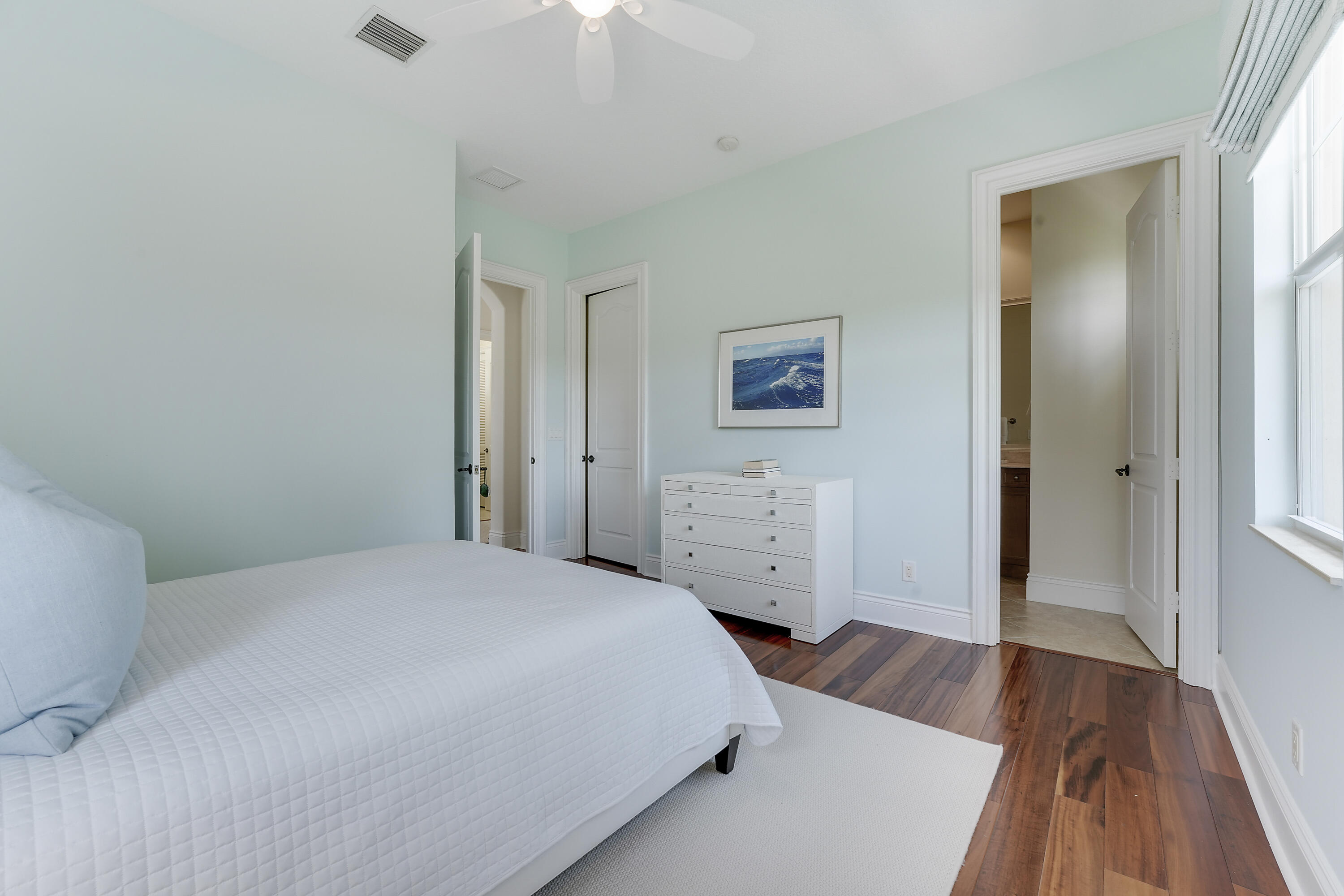 140 Tulip Tree Court Jupiter, FL 33458 - Photo 58 of 80 a bedroom with a bed and a dresser