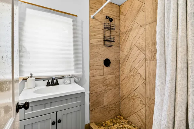 a view of a backyard with a swimming pool