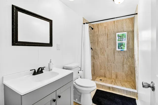 a view of a field with an ocean