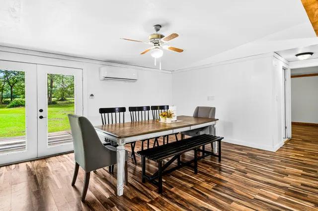 a large kitchen with stainless steel appliances granite countertop a stove a sink and a refrigerator