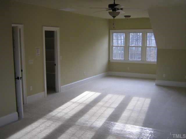 3226 Rain Forrest Way Raleigh, NC 27614 - Photo 10 of 12 The playroom/bonus room/media room is accessible from the stairs at the back of the home or the second floor hallway! It features a walk -in closet for storage.
