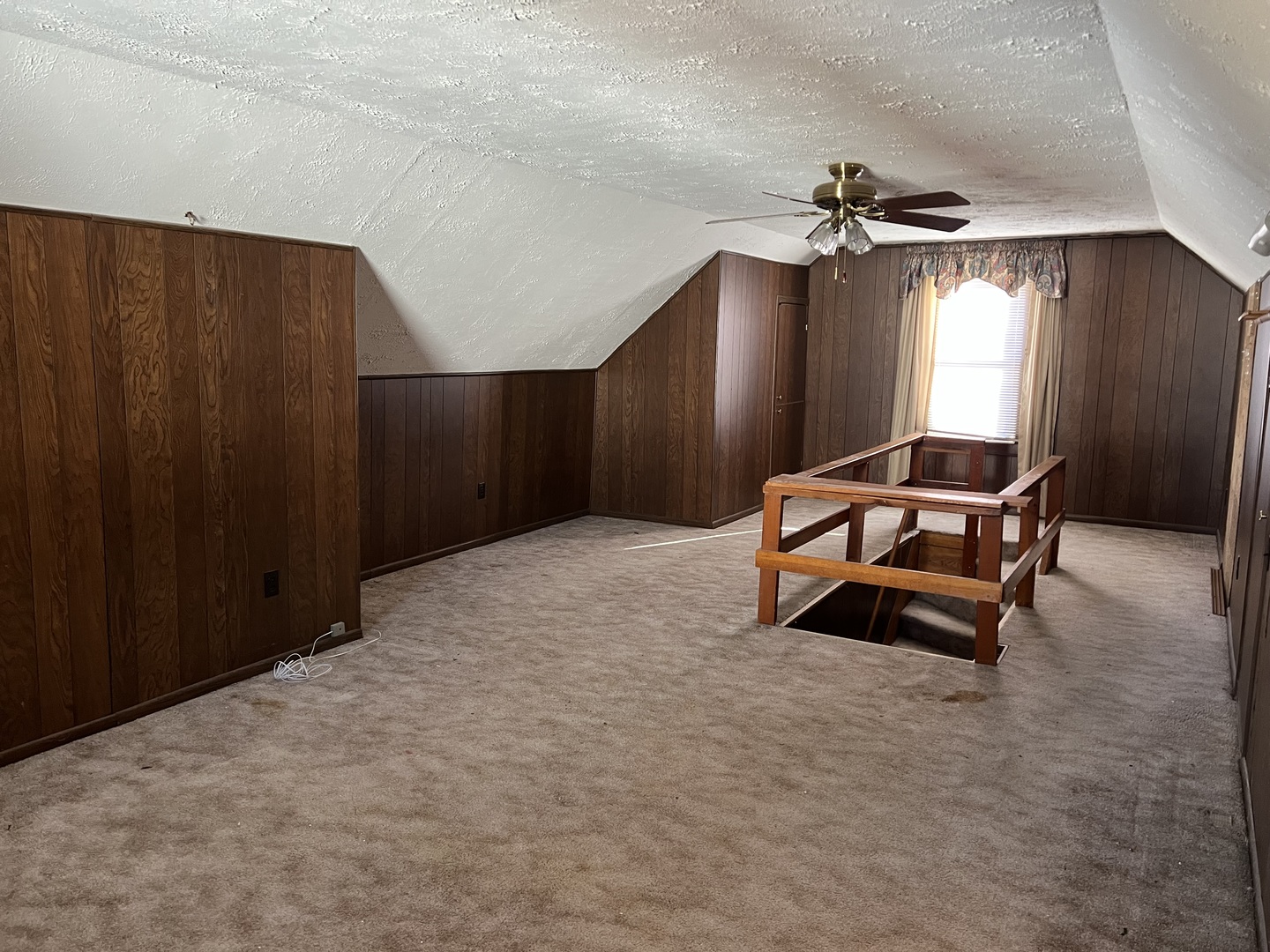 681 South Tanner Avenue Kankakee, IL 60901 - Photo 27 of 33 a room with gym equipment and a chandelier