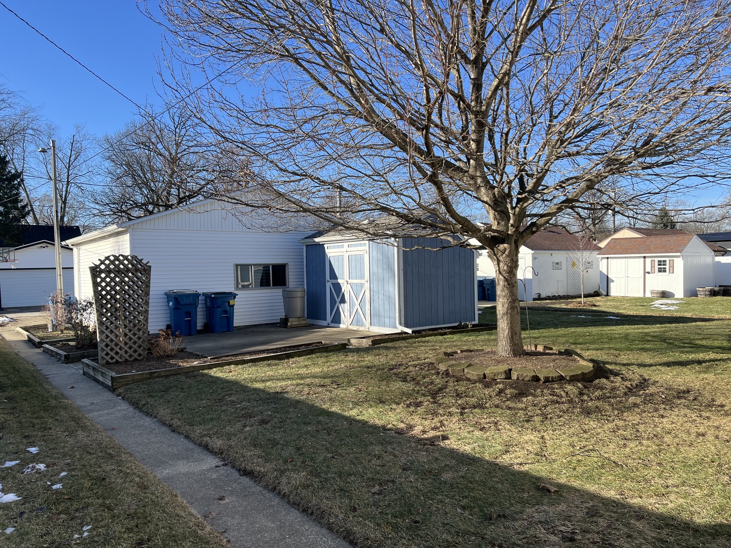681 South Tanner Avenue Kankakee, IL 60901 - Photo 32 of 33 a view of a house with a yard and large tree