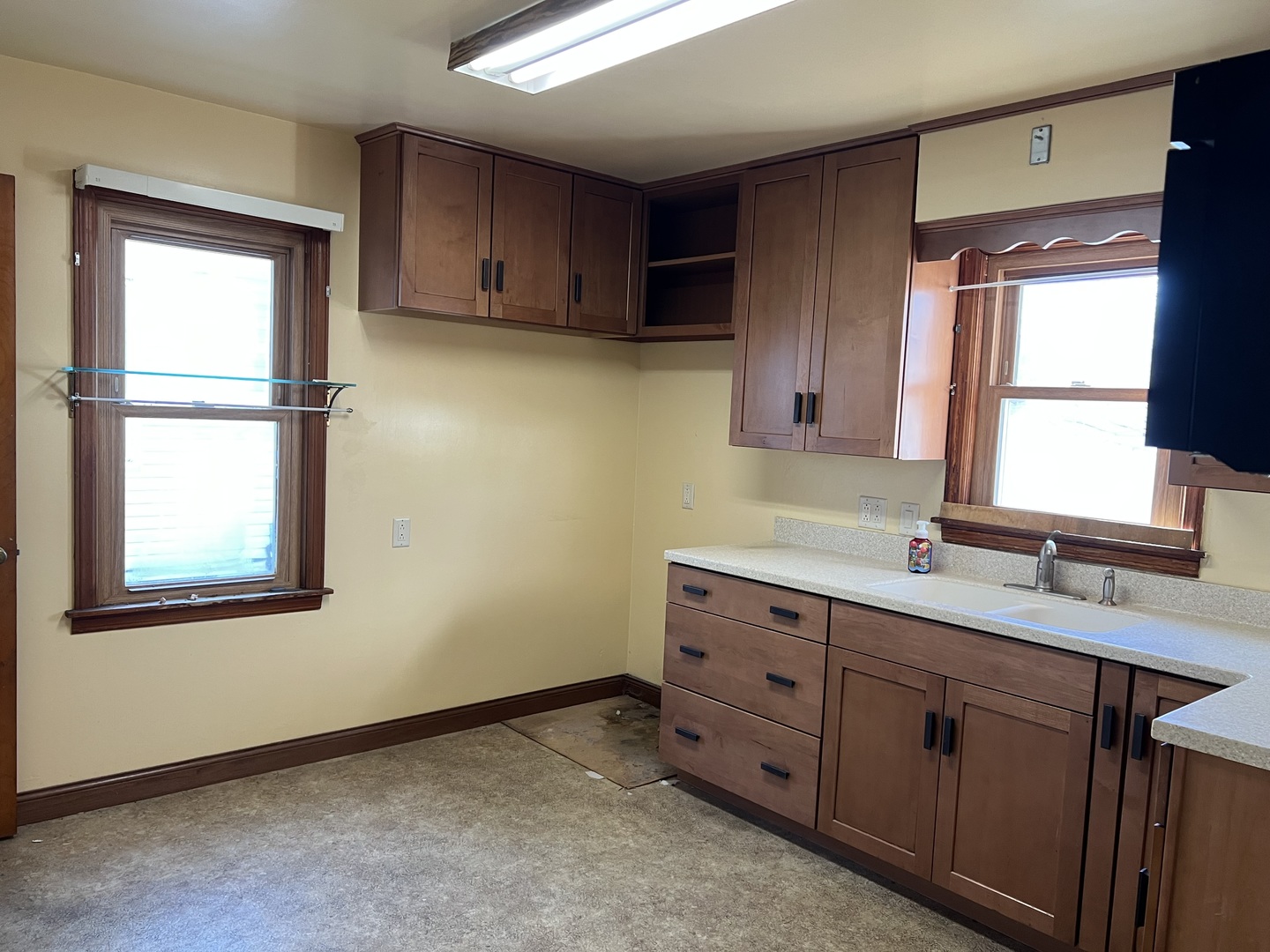 681 South Tanner Avenue Kankakee, IL 60901 - Photo 6 of 33 a kitchen with sink cabinets and window