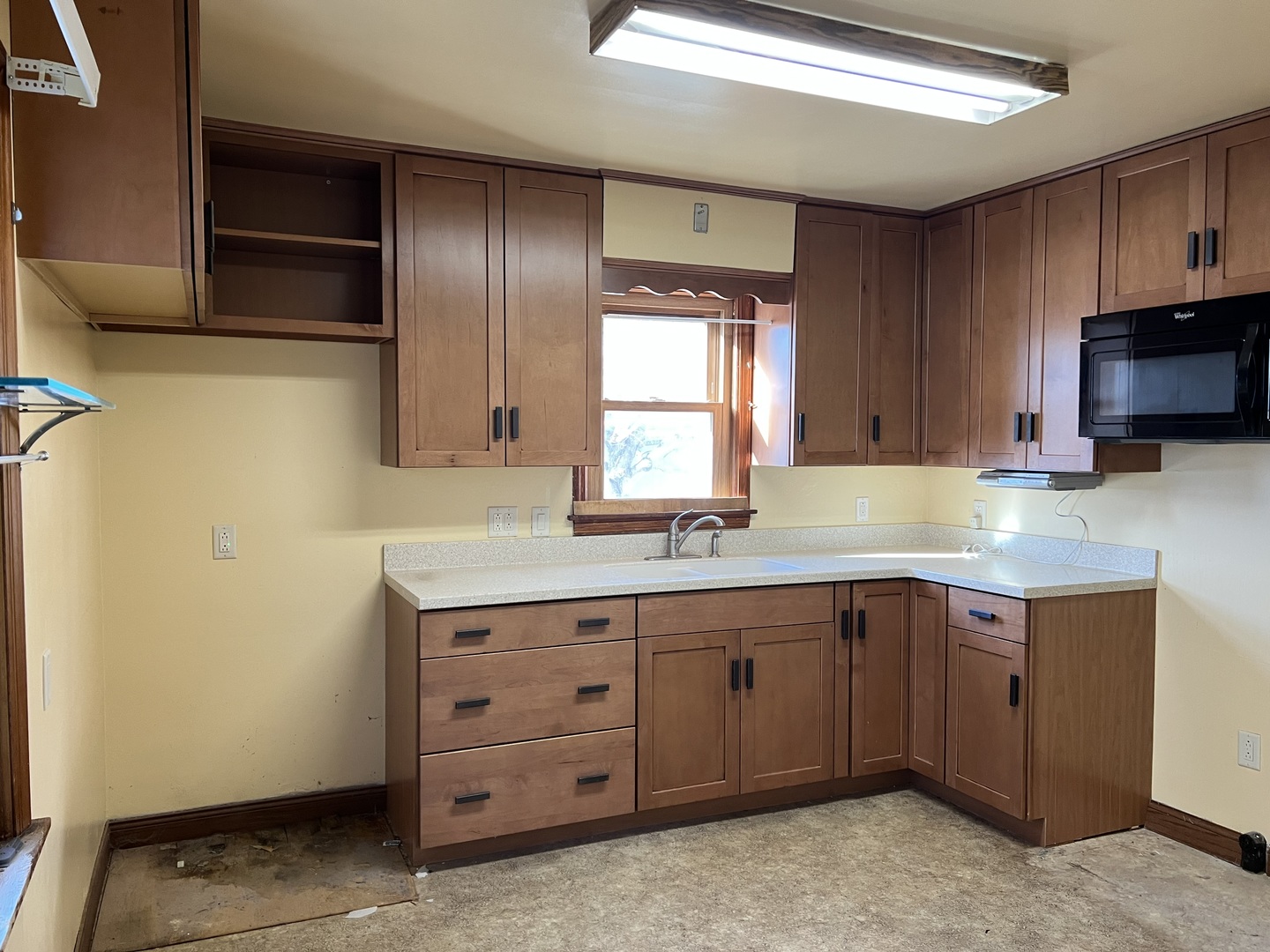 681 South Tanner Avenue Kankakee, IL 60901 - Photo 7 of 33 a kitchen with a sink and cabinets