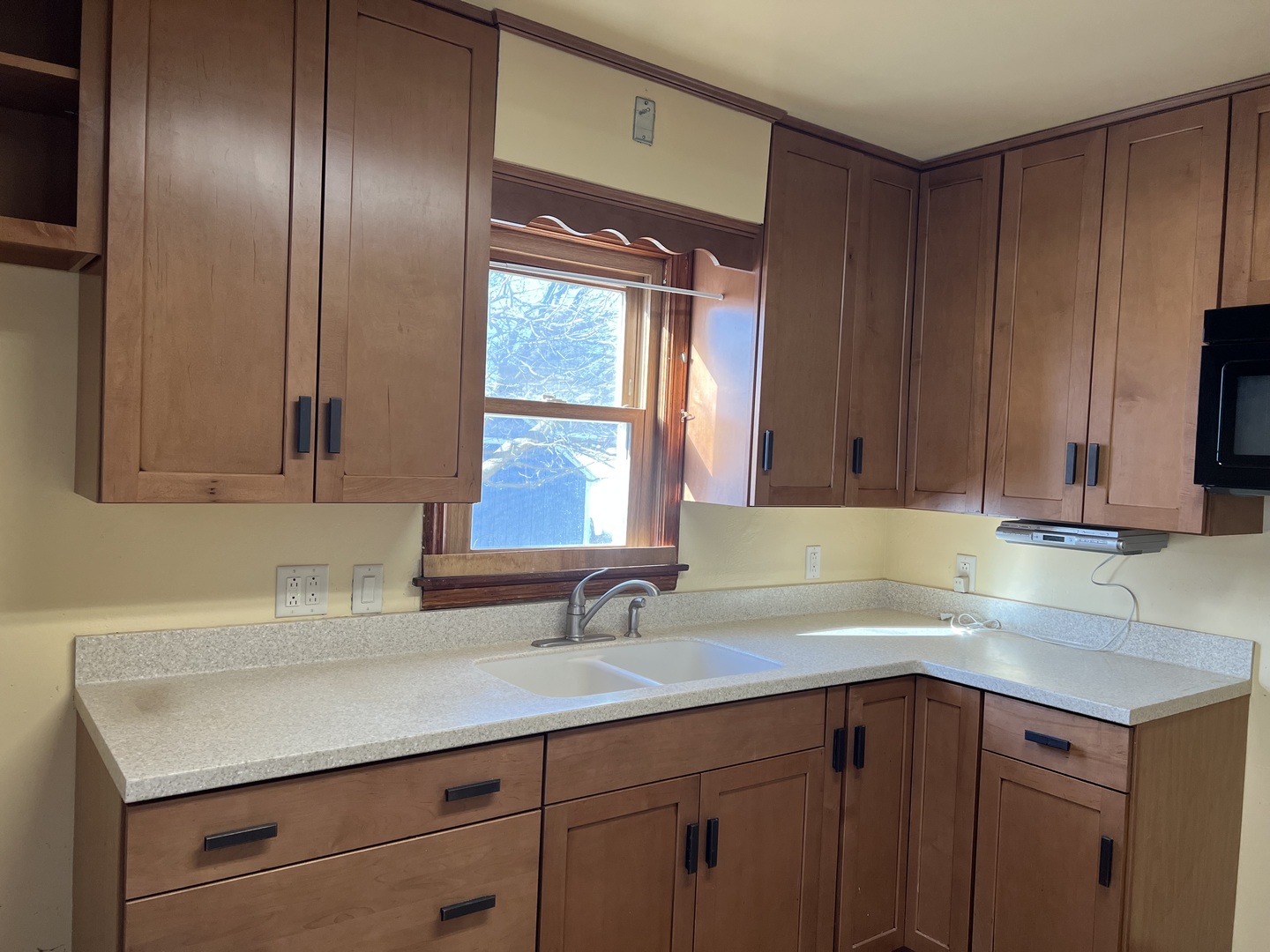 681 South Tanner Avenue Kankakee, IL 60901 - Photo 8 of 33 a kitchen with a sink cabinets and a window