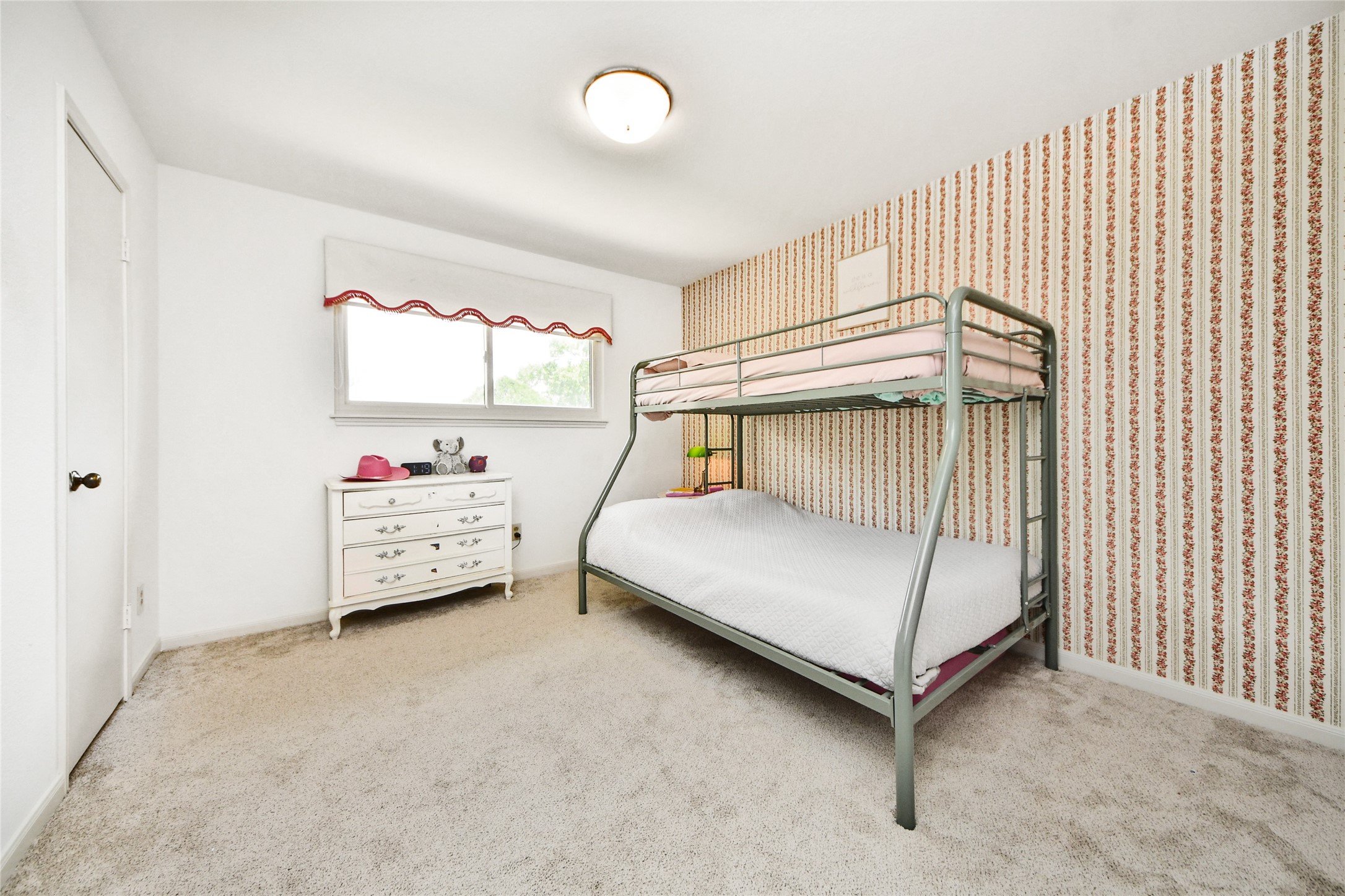 3030 Bernadette Lane Houston, TX 77043 - Photo 21 of 31 a bedroom with a bed and window