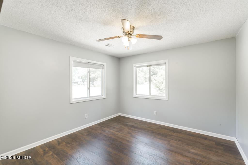 3710 Sandy Circle Macon, GA 31216 - Photo 31 of 44 a view of an empty room with wooden floor and a window