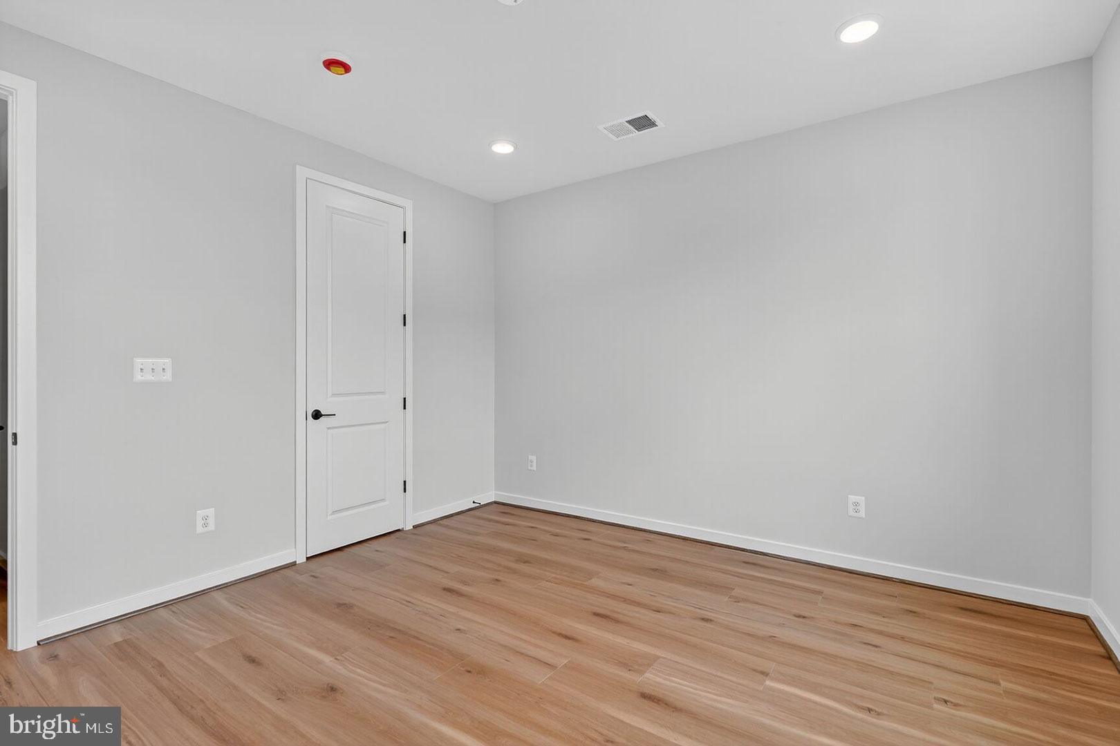 116 Pepperell Street Alexandria, VA 22304 - Photo 11 of 19 a view of an empty room with wooden floor