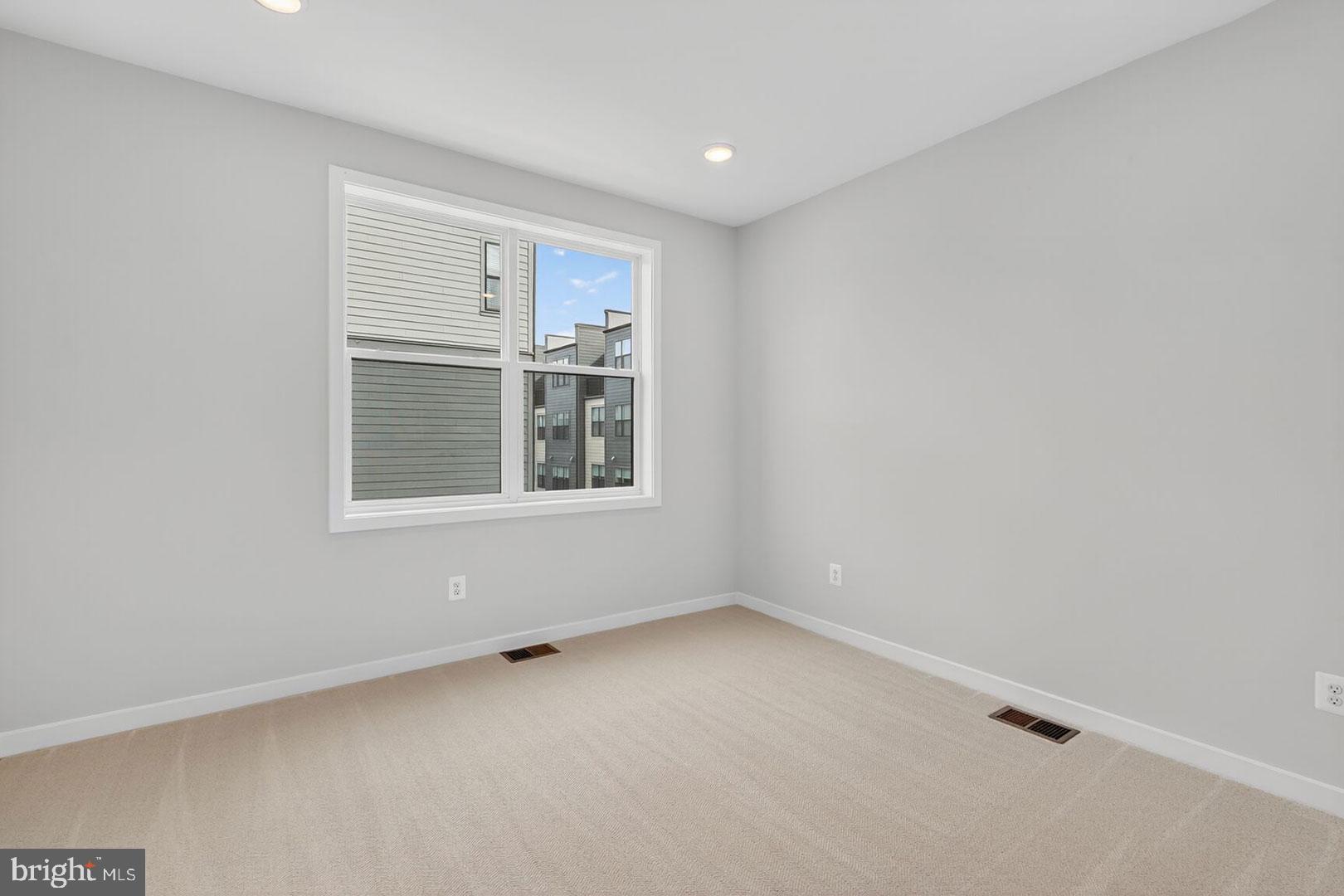 116 Pepperell Street Alexandria, VA 22304 - Photo 14 of 19 an empty room with windows