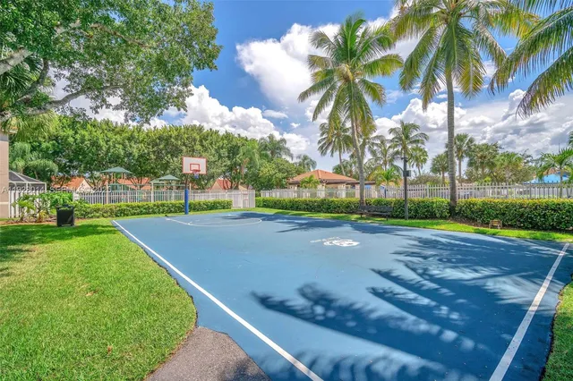 a view of a playground with basketball court