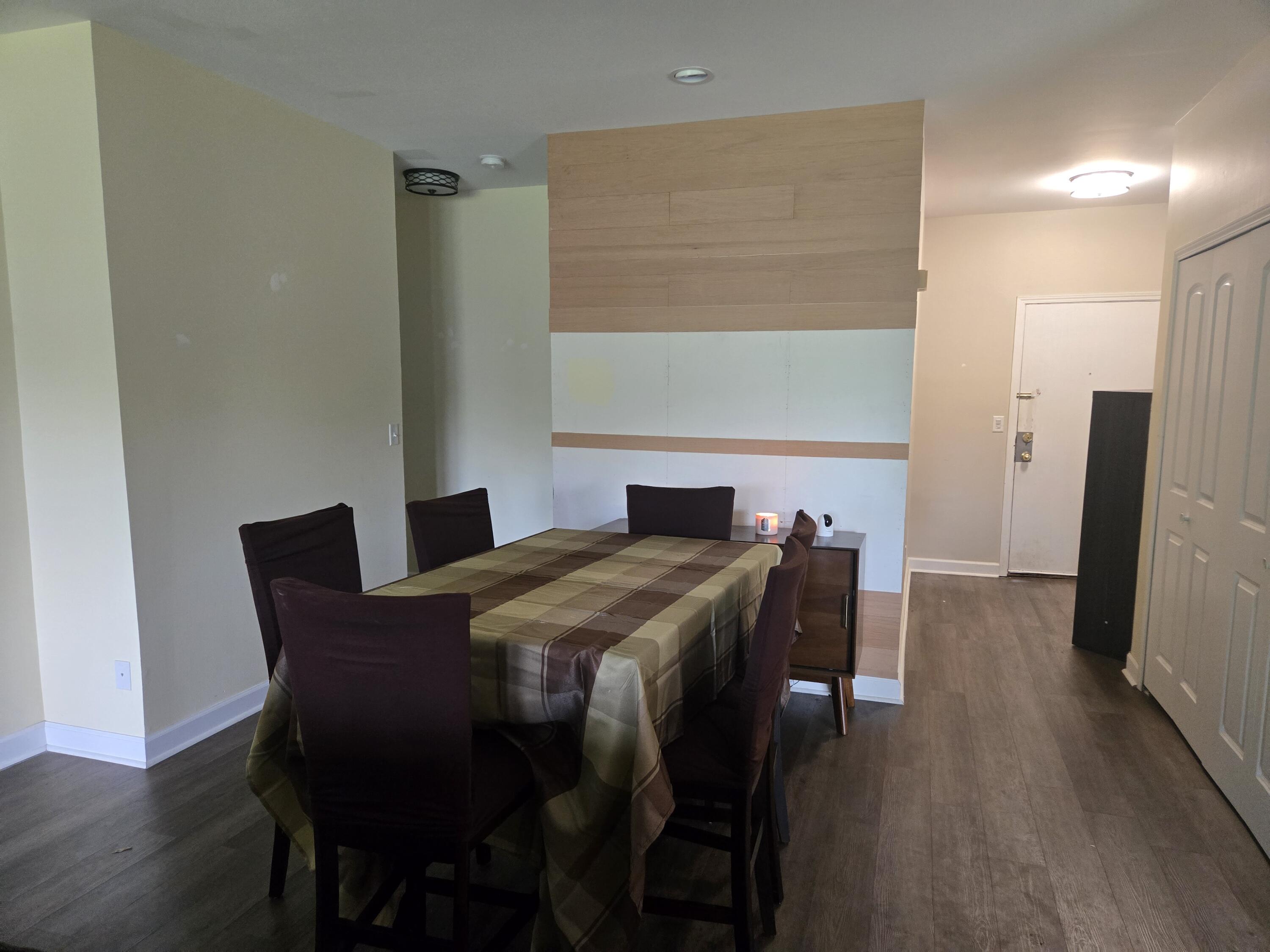 1300 Winding Ridge Lane, Unit C8 Valparaiso, IN 46383 - Photo 3 of 13 a view of a dining room with furniture and wooden floor