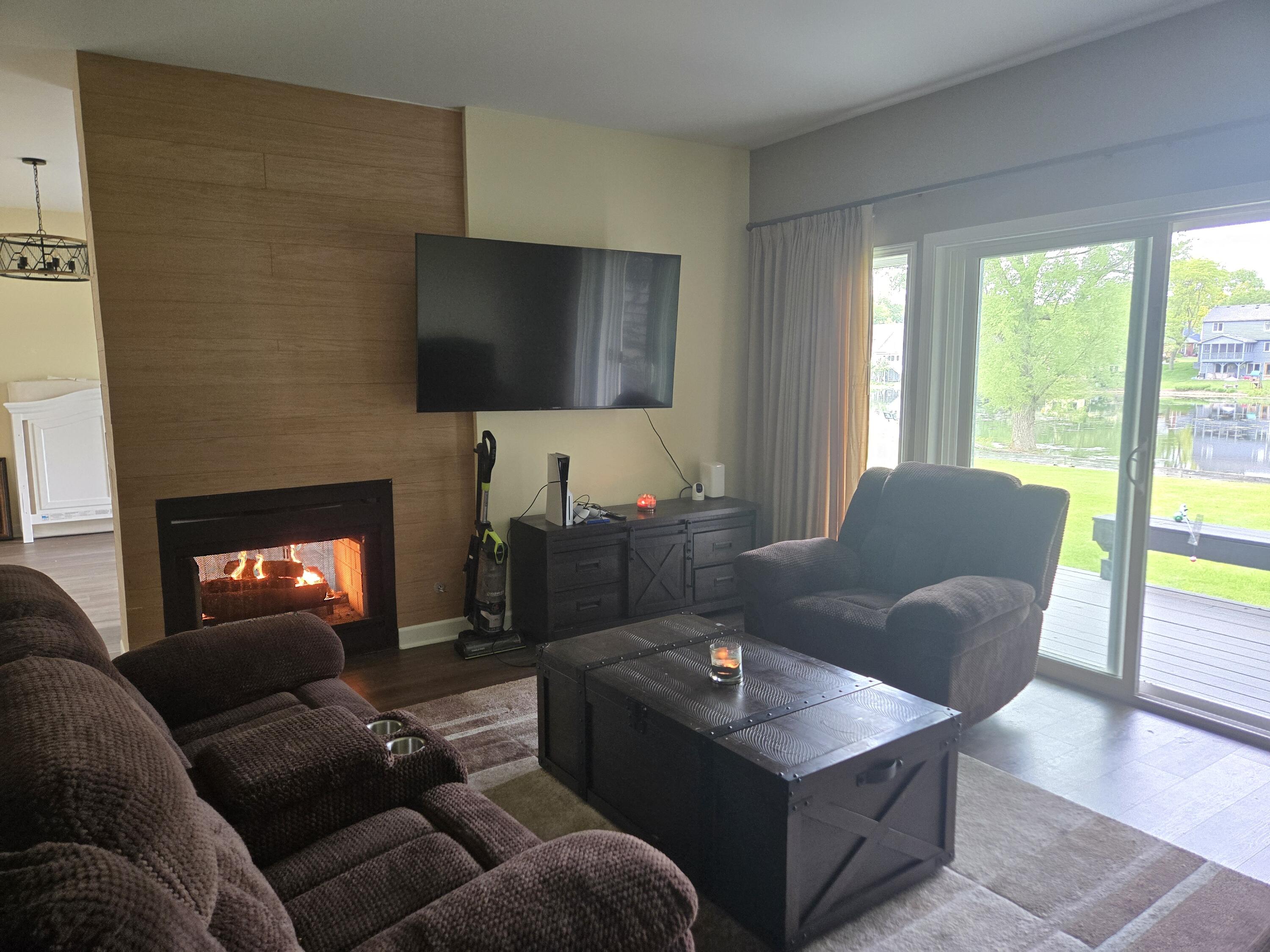 1300 Winding Ridge Lane, Unit C8 Valparaiso, IN 46383 - Photo 4 of 13 a living room with furniture and a flat screen tv