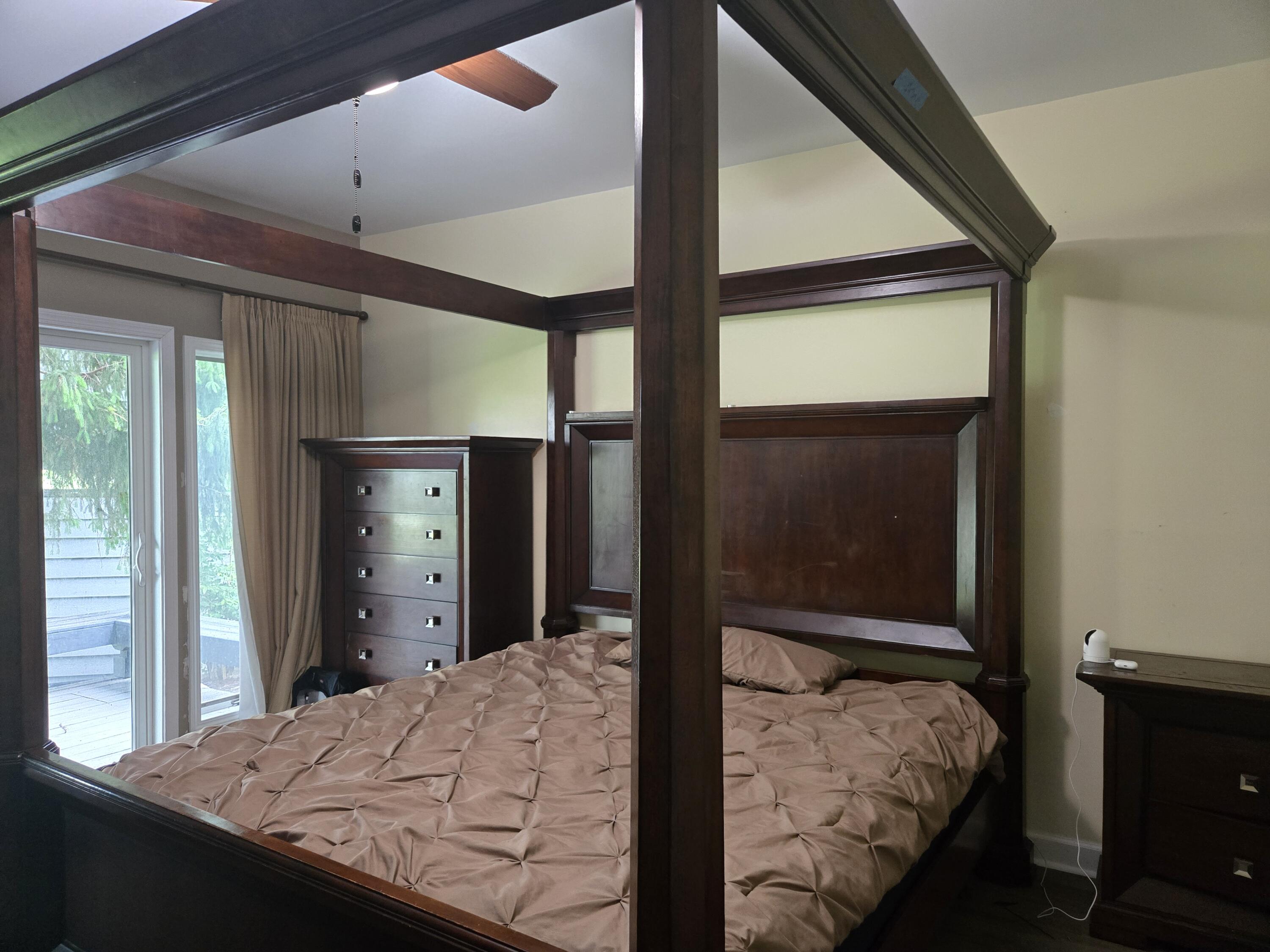 1300 Winding Ridge Lane, Unit C8 Valparaiso, IN 46383 - Photo 7 of 13 a bedroom with a bed and a dresser next to a window
