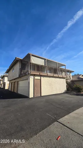 a view of a house with a street
