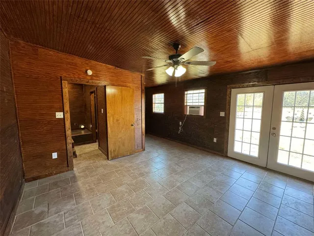 a view of an empty room with a bathroom