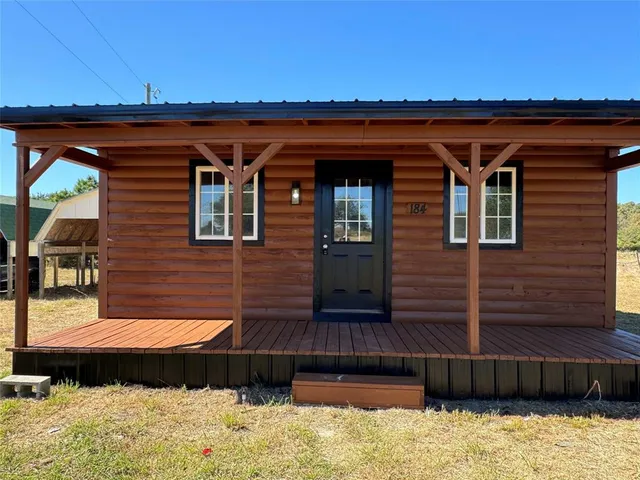 a view of wooden door and outdoor space
