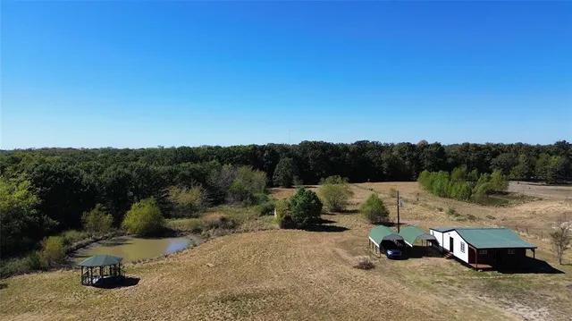 a view of a fire pit with a yard