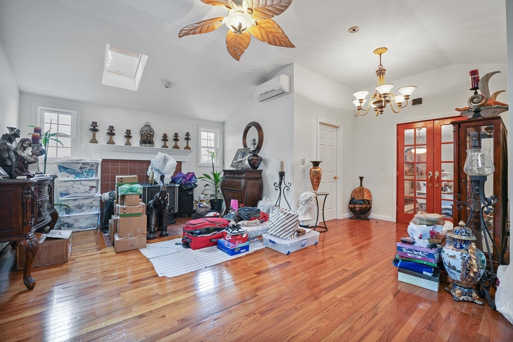 493 Peckham Street Fall River, MA 02721 - Photo 18 of 38 a living room with furniture and wooden floor