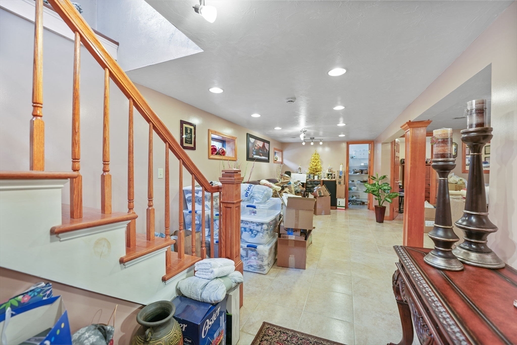 493 Peckham Street Fall River, MA 02721 - Photo 19 of 38 a view of a livingroom with furniture and a potted plant