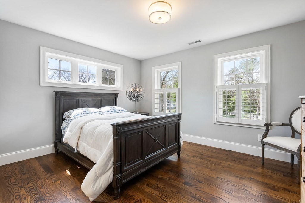 25 Byron Road Weston, MA 02493 - Photo 12 of 21 a bed sitting in a bedroom next to a window