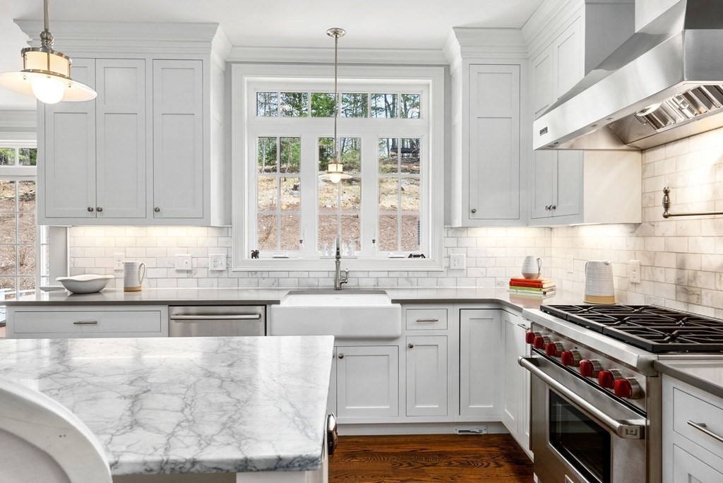 25 Byron Road Weston, MA 02493 - Photo 7 of 21 a kitchen with stainless steel appliances granite countertop a stove a sink and a white cabinets