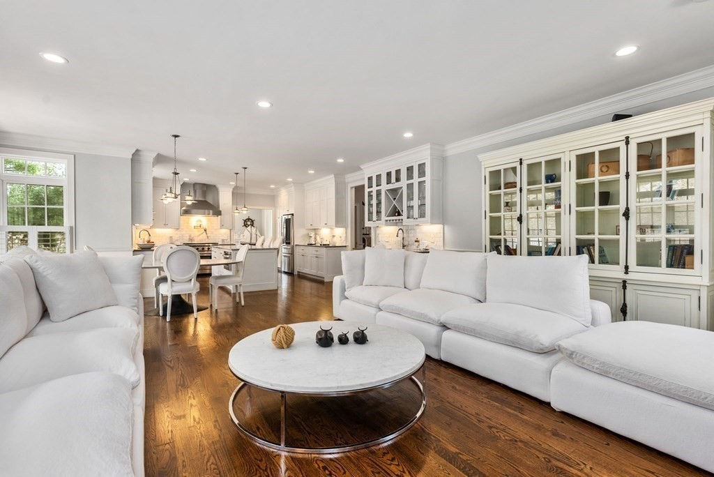 25 Byron Road Weston, MA 02493 - Photo 10 of 21 a living room with furniture and a dining table with wooden floor